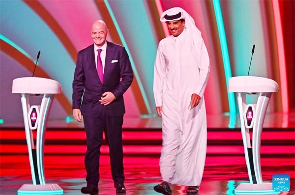 FIFA president Gianni Infantino (left) and the Emir of Qatar Sheikh Tamim bin Hamad al-Thani attend the FIFA World Cup 2022 main draw at Doha Exhibition & Convention Center (DECC) in Doha, Qatar on Friday.