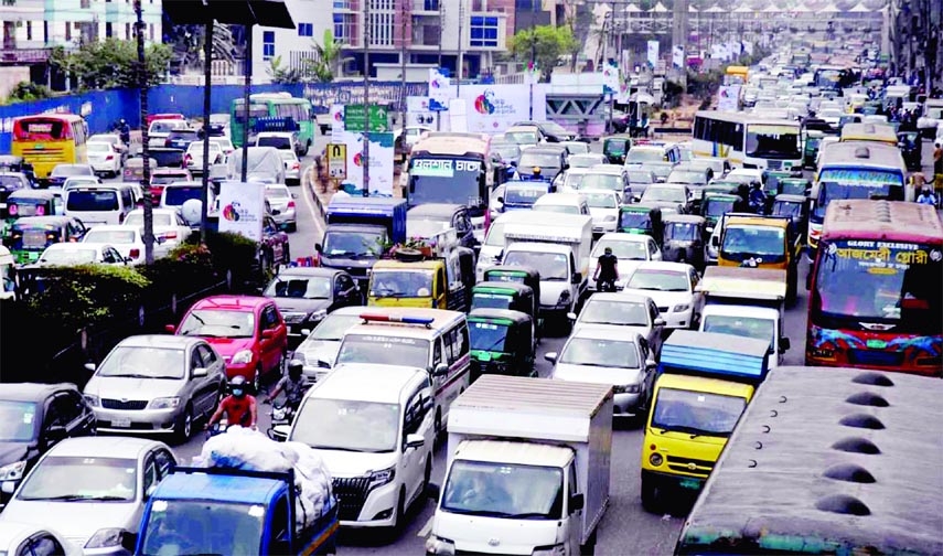 Hundreds of vehicles get clogged with huge traffic gridlock on the first day of Holy Ramzan on Sunday, as many people came out from working places to attend Iftar with their dear ones at home. This photo was taken from Banani area in the capital.