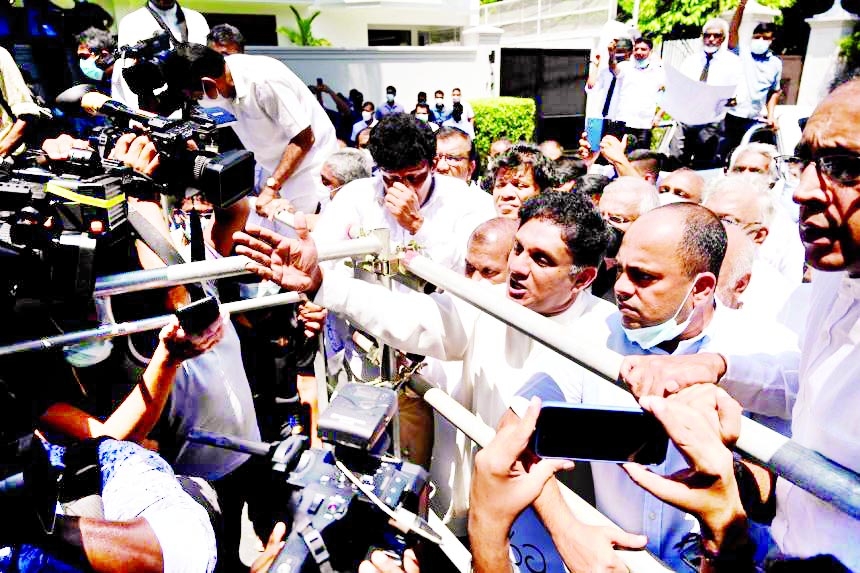 Sri Lankan opposition leader Sajith Premadasa (centre) and other members of parliament protesting in Colombo on Sunday.