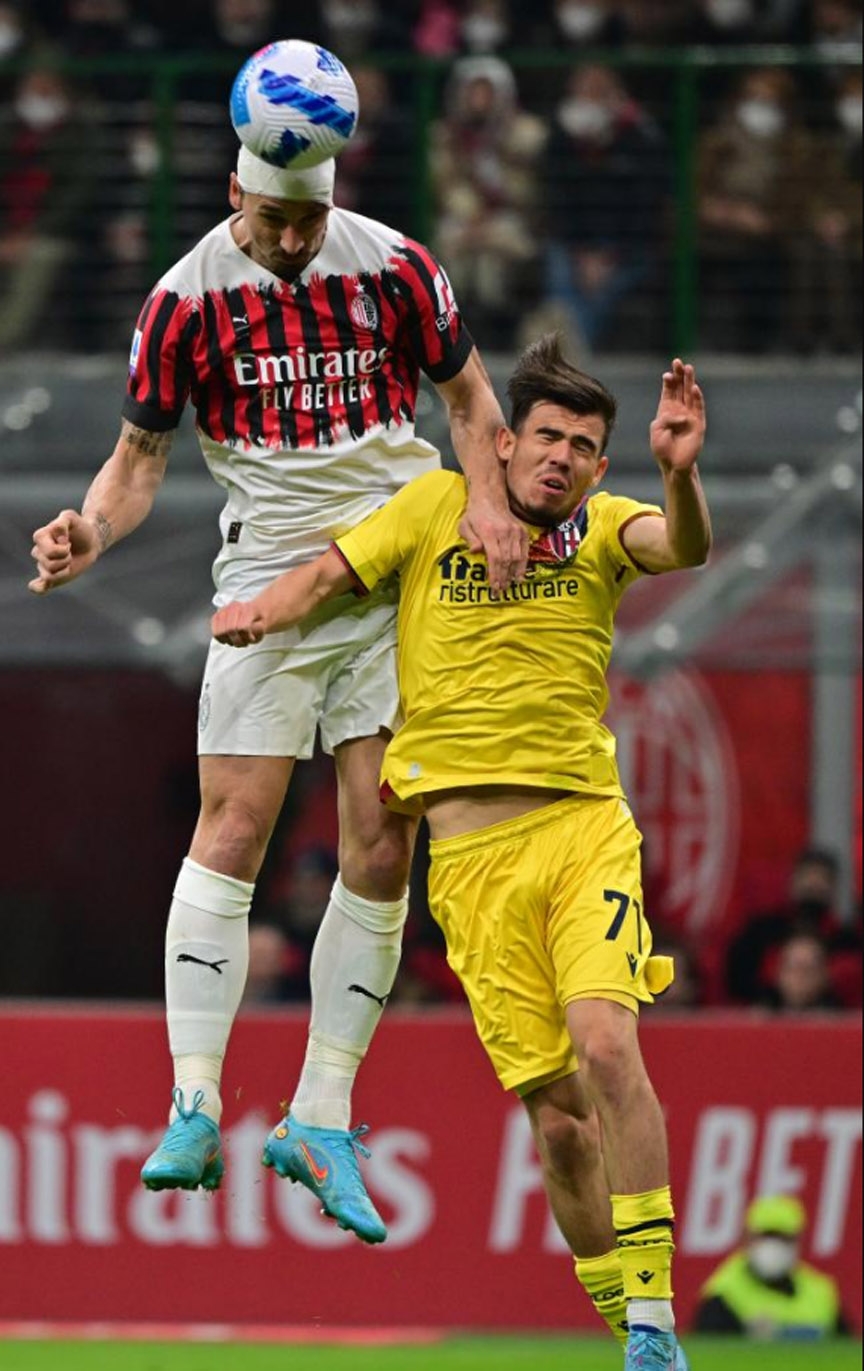 AC Milan's Zlatan Ibrahimovic (left) vies with Bologna's Denso Kasius during a Serie A football match between AC Milan and Bologna in Milan, Italy on Monday. Agency photo