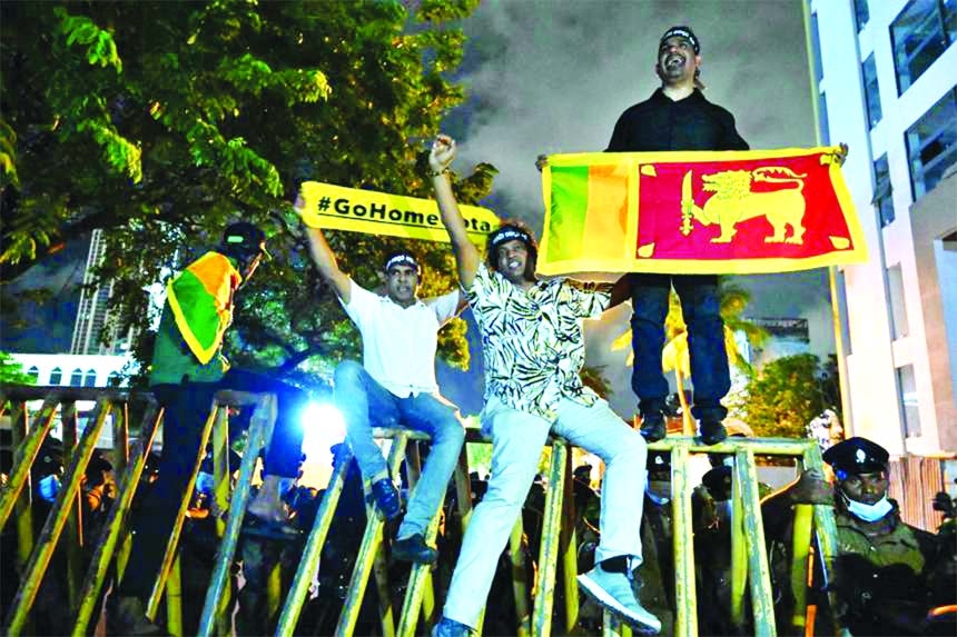 Protesters at the entrance road of the Sri Lanka Prime Minister's official residence in Colombo on Friday.