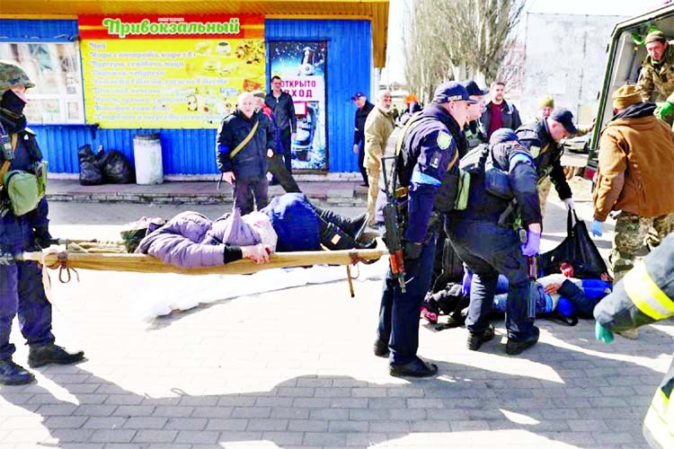 Emergency personnel tend to wounded in the aftermath of a rocket attack on the railway station in the Ukraine's eastern city of Kramatorsk on Friday.