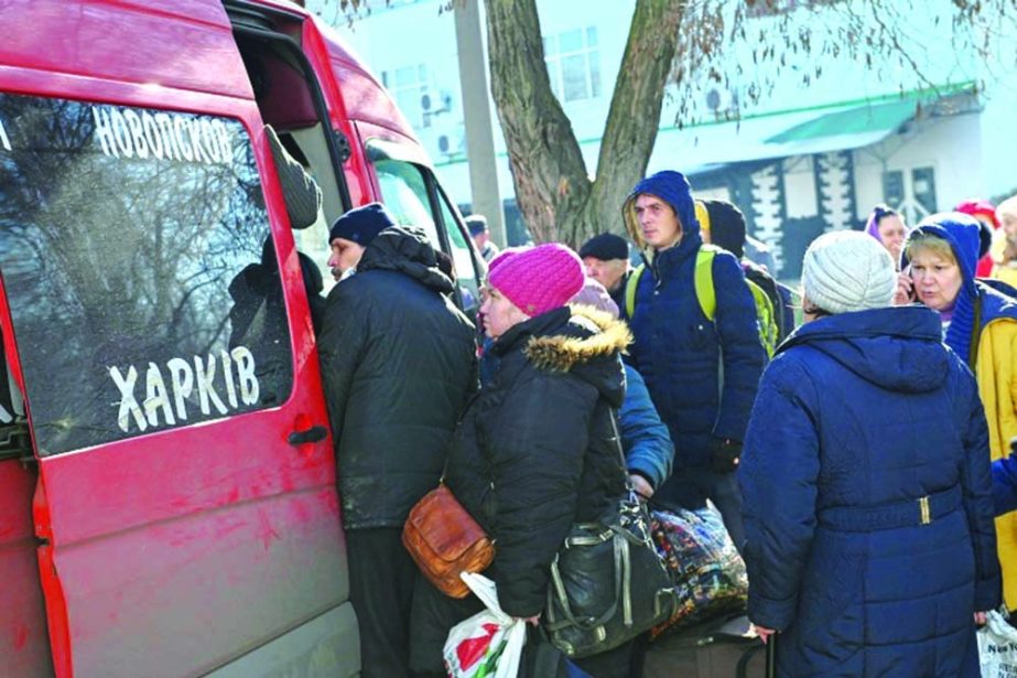 People queue to board a bus as they flee Russia's attack on Ukraine, in Sievierodonetsk, Luhansk region, Ukraine. Agency photo