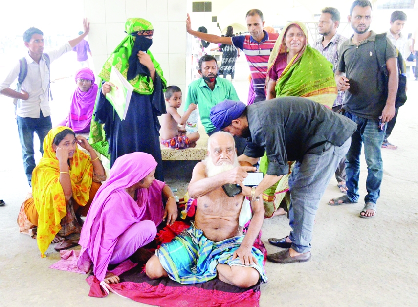 An elderly passenger becomes sick while waiting for train at Kamalapur Railway Station in the capital on Wednesday as sudden strike called by Bangladesh Railway running staff disrupted train schedules.