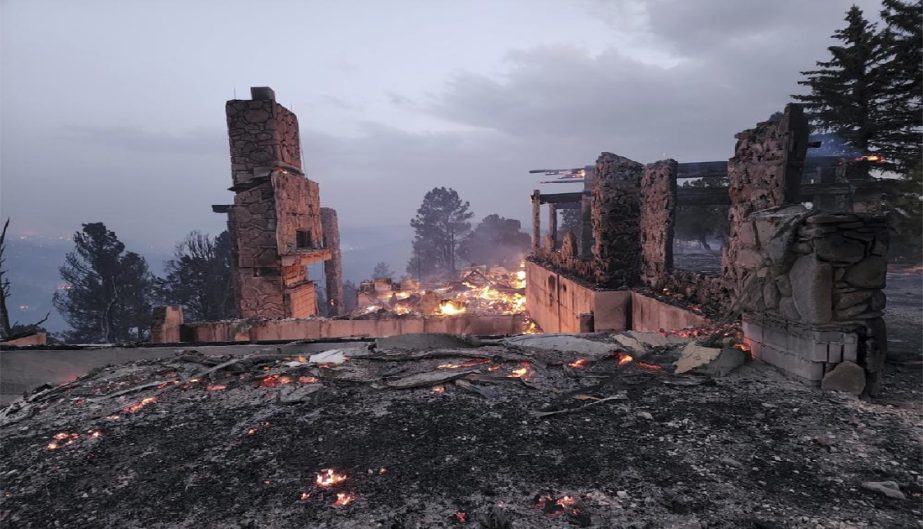 The remains of a home left after a wildfire spread through the Village of Ruidoso, New Mexico, on Wednesday, April 13, 2022. Officials say a wildfire has burned about 150 structures, including homes, in the New Mexico town of Ruidoso.