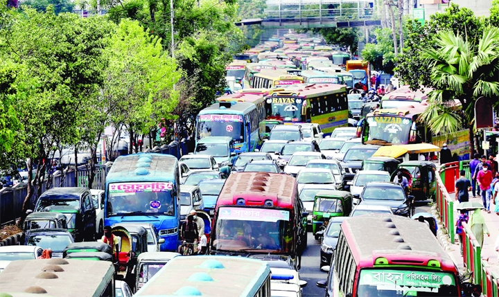 Heavy traffic congestion is seen even on weekly holiday at Mirpur Road in Dhanmondi area on Saturday.