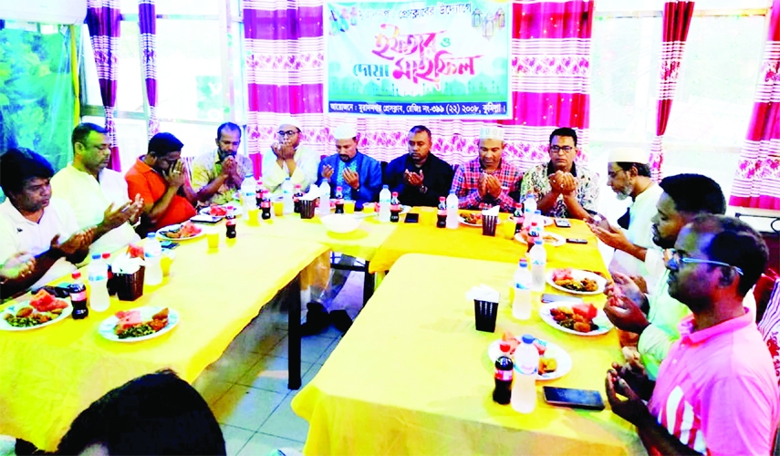 MURADNAGAR (Cumilla): Journalists offer Munajat at an Iftar and Doa Mahfil organised by Muradnagar Press Club on Sunday.