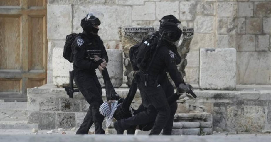 AP Photo: Israeli police carry a Palestinian protester during clashes at the Al Aqsa Mosque compound in Jerusalem's Old City, Friday, April 22, 2022.