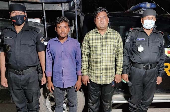 RAB-4 detains two drug peddlers with huge phensidyl conducting raid at the areas under Savar Model Thana under Dhaka district on Friday.