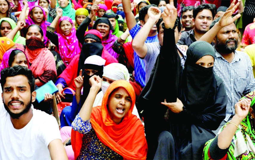 Workers of Cotton Textile and Apparels block the road of Mirpur-11 on Saturday demanding arrear salary and Eid bonus.