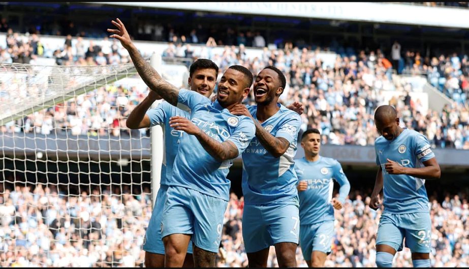 Manchester City's Gabriel Jesus (front) celebrates with teammates after scoring their fourth goal to complete his hat-trick during an English Premier League match against Watford on Saturday. Agency photo