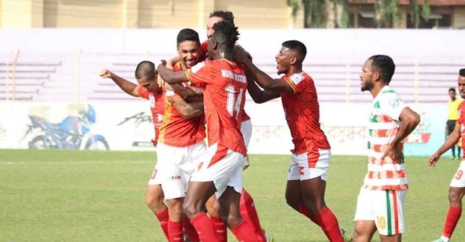 Players of Bashundhara Kings celebrate after scoring a goal against Swadhinata Krira Sangha in their match of the TVS Bangladesh Premier League Football at Muktijoddha Smrity Stadium in Rajshahi on Sunday. Agency photo