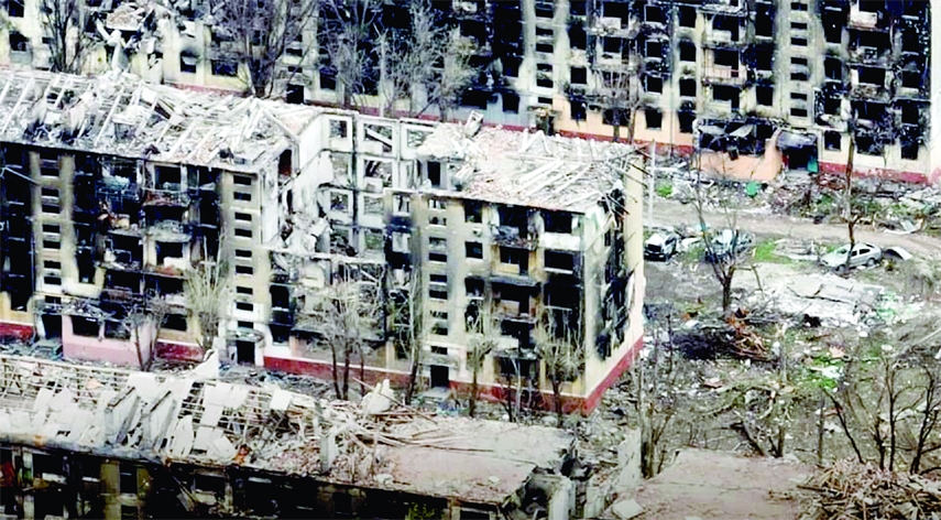 An aerial view shows damaged buildings in Mariupol amid Russia’s ongoing invasion of Ukraine. This handout picture taken with a drone released on Sunday.