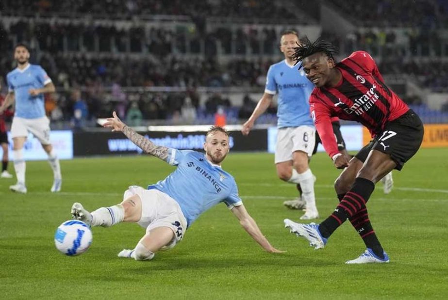 AC Milan's Rafael Leao (right) kicks the ball ahead of Lazio's Manuel Lazzari during the Serie A soccer match between Lazio and AC Milan, at Rome's Olympic Stadium, Italy on Sunday. AP photo