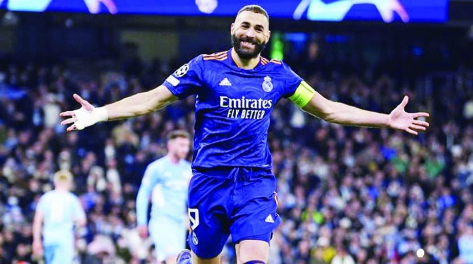 Real Madrid's Karim Benzema celebrates after scoring his side's third goal against Manchester City during the Champions League semi final, first leg football match at the Etihad stadium in Manchester, England on Tuesday. Agency photo