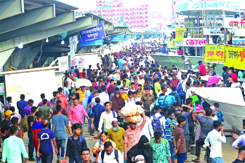 Thousands of home-bound passengers crowd at the Sadarghat Launch Terminal in the capital on Friday before travelling to their village homes ahead of Eid-ul-Fitr.