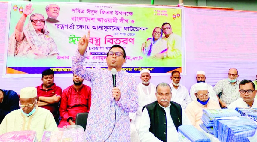 Deputy Minister for Water Resources AKM Enamul Haque Shamim speaks at the Eid clothes distribution among destitute on behalf of AL and Begum Ashrafunnesa Foundation at Naria in Shariatpur on Saturday.