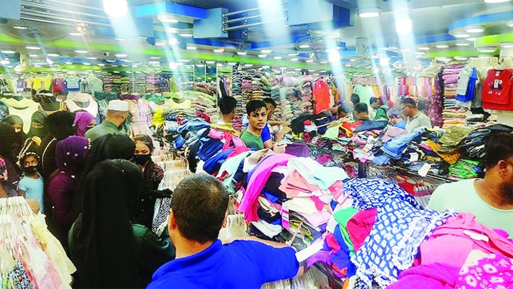 SYLHET: Both shopkeepers and buyers pass busy time in shopping malls Sylhet . This picture was taken on Friday.