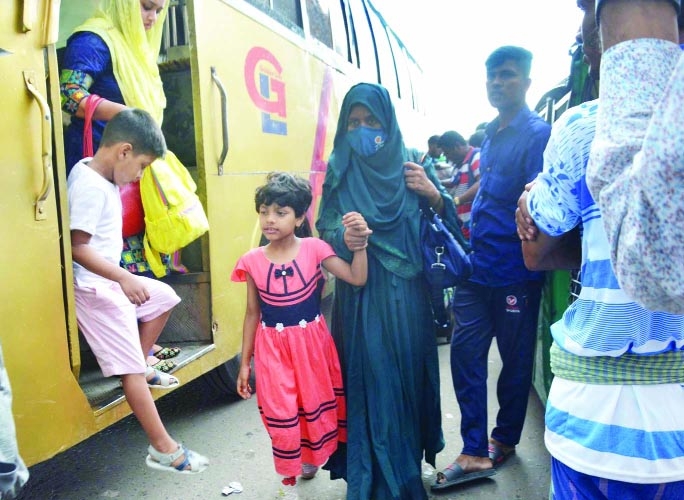 People returning to city after celebrating Eid-ul-Fitr. The snap was taken from the city's Saedabad Bus Terminal on Friday.