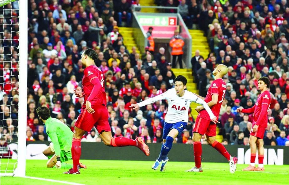 Tottenham Hotspur's striker Son Heung-Min (center) celebrates after scoring the opening goal of the English Premier League football match against Liverpool, at Anfield in Liverpool, north west England on Saturday. Agency photo