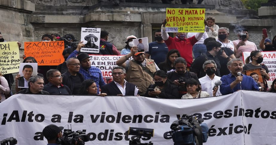 Journalists protest to draw attention to the latest wave of journalist killings, at the Angel of Independence monument in Mexico City, Monday, May 9, 2022.