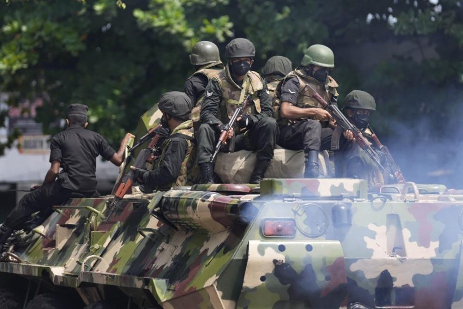 Sri Lankan army soldiers patrol during curfew in Colombo, Sri Lanka, Wednesday, May 11, 2022.