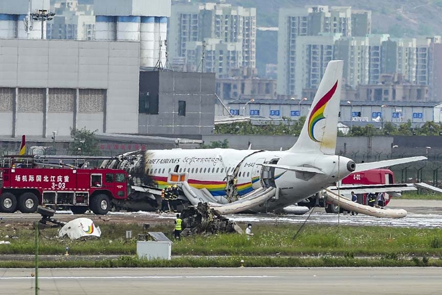 In this photo released by Xinhua News Agency, a passenger jet that veered off a runway during take-off and caught fire is seen in the aftermath in Chongqing Jiangbei International Airport in southwestern China's Chongqing Thursday, May 12, 2022.