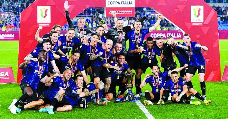 Players of Inter Milan celebrate with trophy after winning the Italian Cup final football match between Juventus and Inter Milan in Rome, Italy on Wednesday. Agency photo