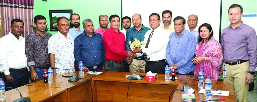 Director of ISPR office Lt. Col. Abdullah Ibne Jaed greets office-bearers of DJAB including its President Mamunur Rashid and General Secretary Alamgir Hossain giving bouquet at ISPR office in Dhaka Cantonment on Thursday.