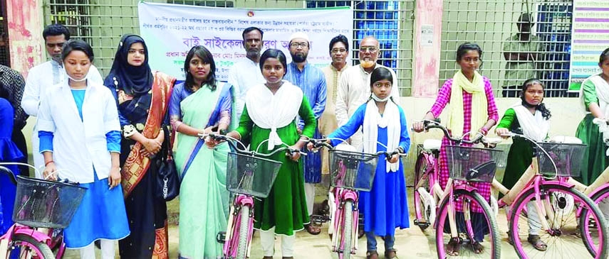 KALAI (Joypurhat) : Minfuzur Rahman Milon, Chairman, Kalai Upazila Parishad distributes bicycles among the tribal students of higher and higher secondary levels in Kalai Upazial recently.