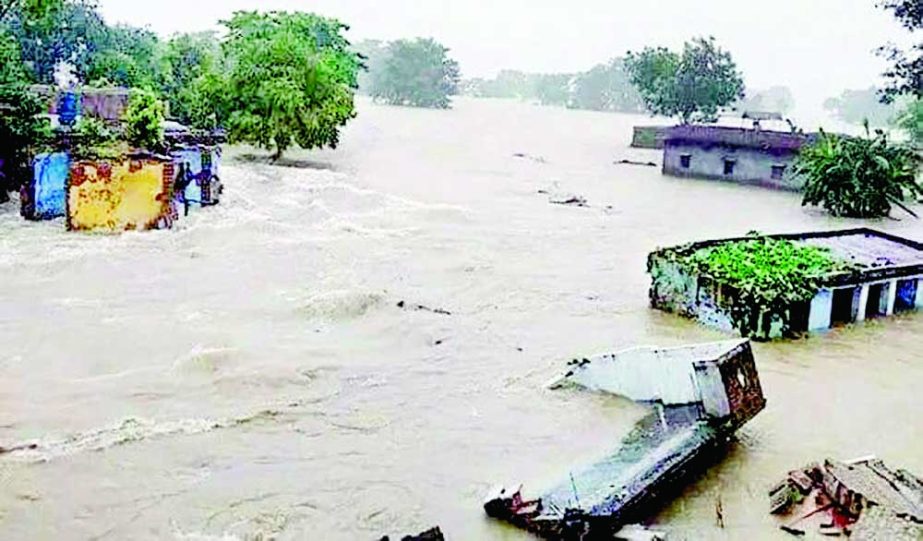 Photo shows the low-lying areas in Sylhet, including the city, flooded due to a downhill onrush of water and heavy rainfall over the last few days. Surma, one of the main rivers of Sylhet, flows above its danger mark on Tuesday. NN photo