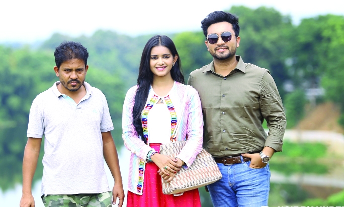 Director Tuhin Hossain, actress Tanjin Tisha and actor Jovan in a photo session in the shooting spot of Eid drama Tonatuni Resort