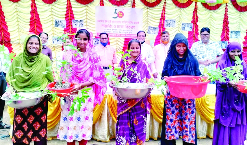 FULBARIA (Mymensingh): Saplings of fruits and vegetables distribute among the mothers of malnutrition at Kaladah Village in Fulbaria Upazila assisted by World Vision Bangladesh on Wednesday.
