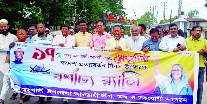 MADHUKHALI (Faridpur) : Madhukhali Upazila Awami League and its front Organisations bring out a rally marking the Homecoming Day of Awami League President and Prime Minister Sheikh Hasina on Wednesday.