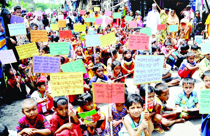 Local children living in Kalyanpur slum sit-in programme on Saturday demanding set up a permanent educational institute.