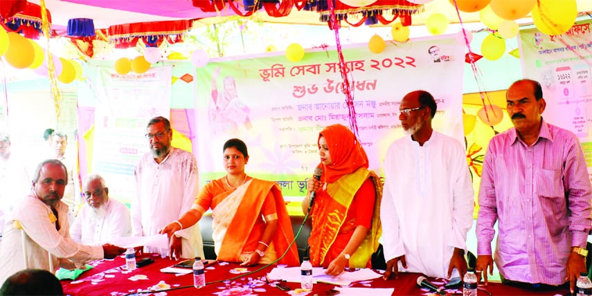 BHANDARIA (Pirojpur): Seema Rani Dhar, UNO, Bhandaria Upazila distributes documents of land as part of free land distribution among the landless people at Bhandaria Upazila on the occasion of the Land Service Week on Sunday.