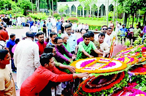 Leaders and activists of different organizations pay tribute to the mausoleum of national poet Kazi Nazrul Islam by placing floral wreaths on Wednesday marking his 123rd birth anniversary.