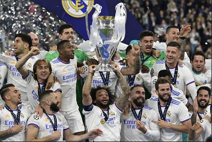 Real Madrid's defender Marcelo (centre) and his teammates celebrate with the trophy after the UEFA Champions League final football match between Liverpool and Real Madrid at the Stade de France in Saint-Denis, north of Paris on Sunday.