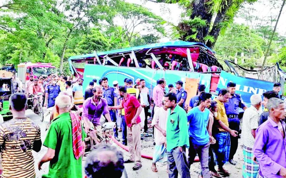 A passenger bus gets smashed being hit with a roadside tree in Bamrail area on Barishal-Dhaka Highway on Sunday leaving 11 people dead, as the driver drove recklessly. NN photo