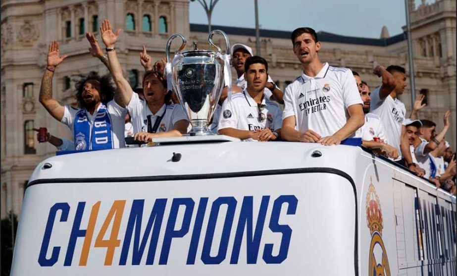 From left to right: Real Madrid's Thibaut Courtois, Luka Modric, Marco Asensio and Marcelo celebrate on an open top bus with the Champions League trophy during the victory parade in Madrid, Spain on Sunday. Agency photo