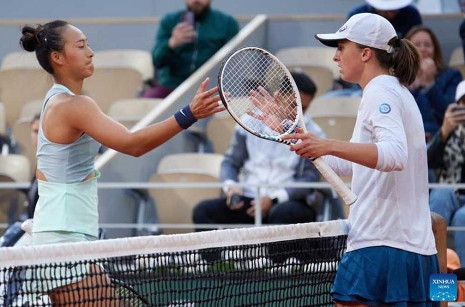 Zheng Qinwen (left) greets Iga Swiatek after the women's singles fourth round match between Zheng Qinwen of China and Iga Swiatek of Poland at the French Open tennis tournament at Roland Garros in Paris, France on Monday. AP photo