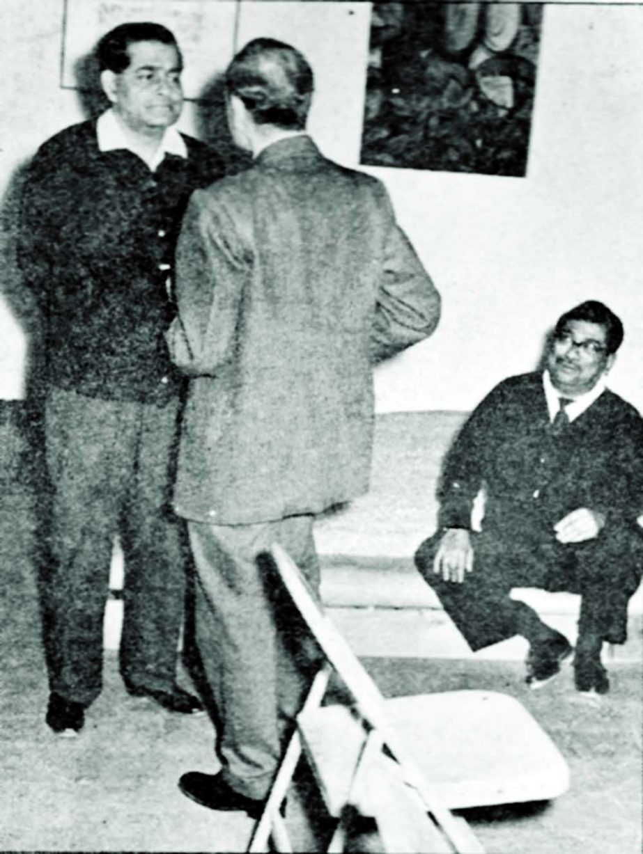 Manik Mia seen talking with a guest at a family function while late Zahur Huseyn Chowdhury (sitting), another renowned journalist, keenly following the conversation.