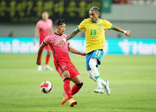 Brazil's Raphinha (right) in action with South Korea's Hwang Hee during the International Friendly football match at Seoul World Cup Stadium, Seoul, South Korea on Thursday.