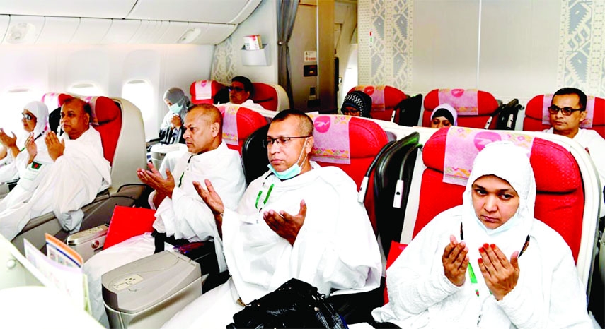Pilgrims offer munajat in a plane before departure to perform Hajj as Holy Hajj flight 2022 commenced on Sunday. This photo was taken from Hazrat Shahjalal International Airoort.