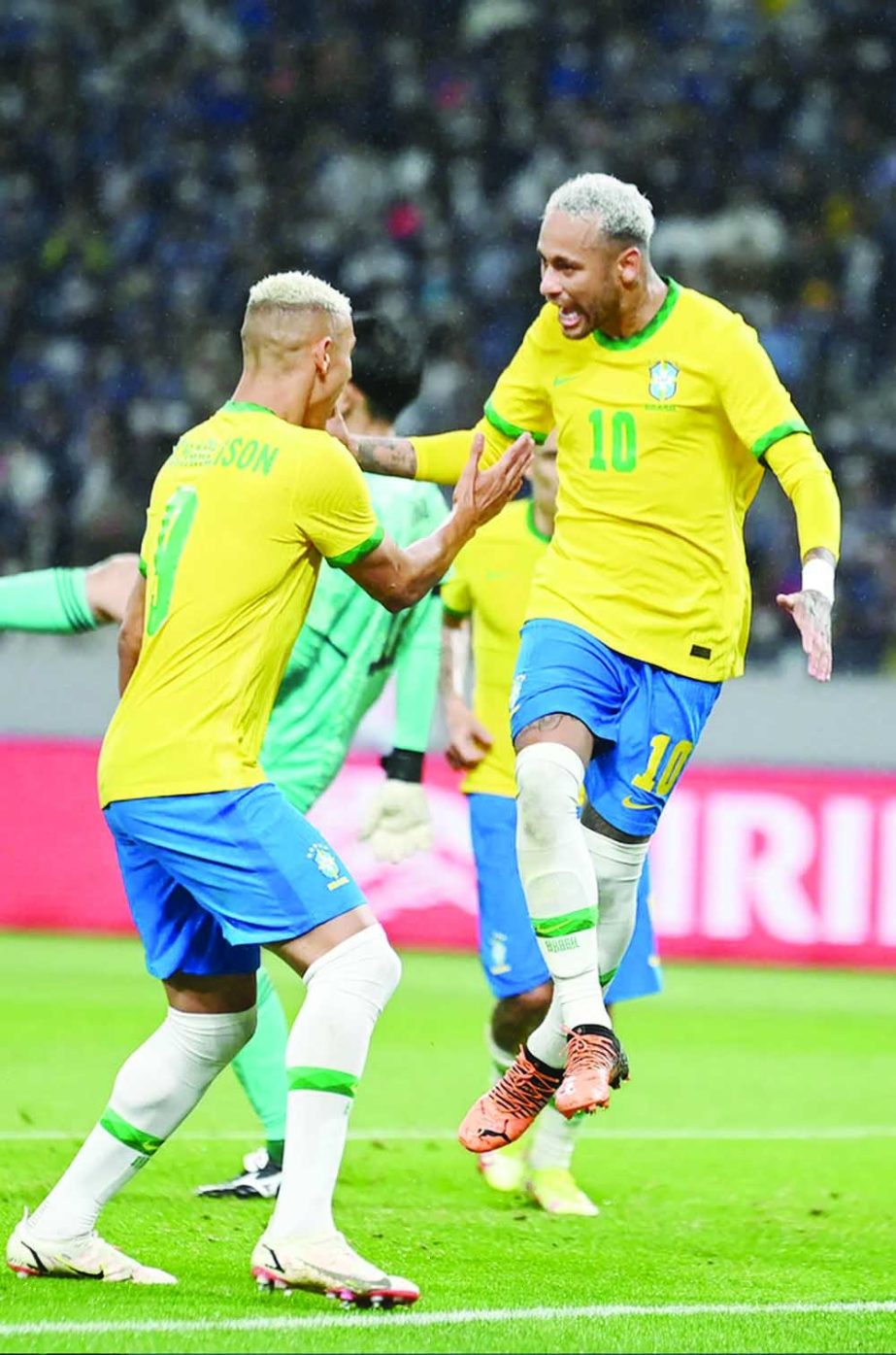 Neymar (right) celebrates after scoring Brazil's winning goal in their FIFA Friendly against Japan at the National Stadium in Tokyo on Monday. Agency photo