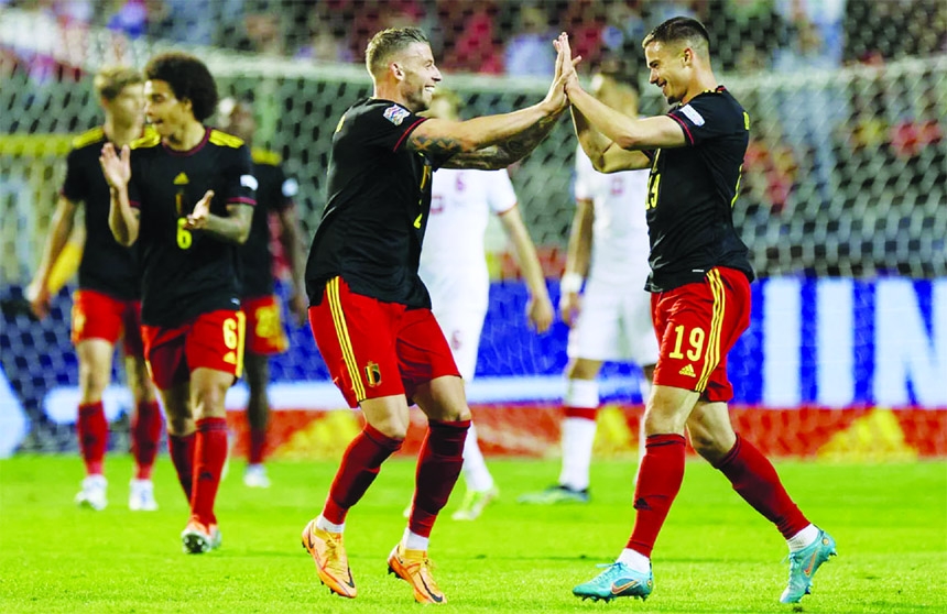 Belgium's defender Leander Dendoncker (right) celebrates scoring his team's fifth goal during the UEFA Nations League football match against Poland at The King Baudouin Stadium in Brussels on Wednesday.