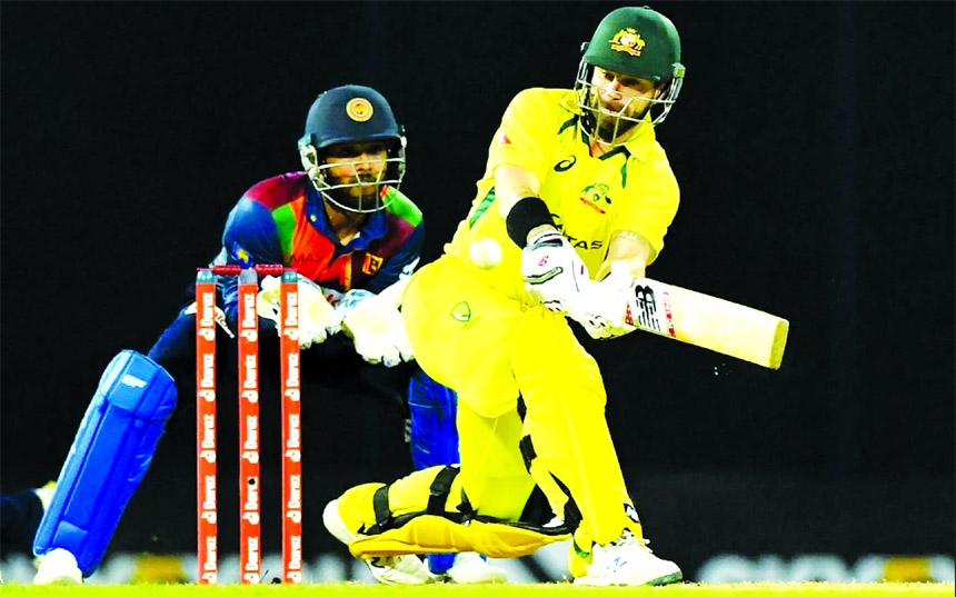 Australia's Matthew Wade (right) plays a shot during the second Twenty20 International cricket match between Sri Lanka and Australia at the R. Premadasa International Cricket Stadium in Colombo on Wednesday.