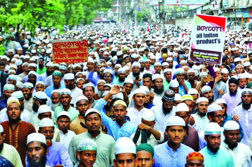 Muslims take part in a procession in Dhaka after the Jumma prayers to protest against the blasphemous comments on Prophet Muhammad (PBUH) by India's BJP leaders.