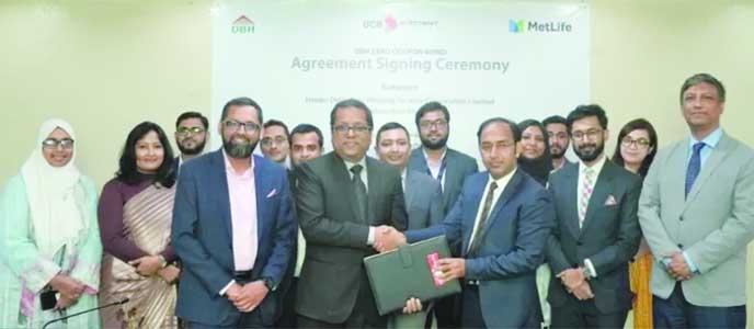 Officials of MetLife Bangladesh, DBH and UCBIL pose for a photograph at a signing ceremony recently.