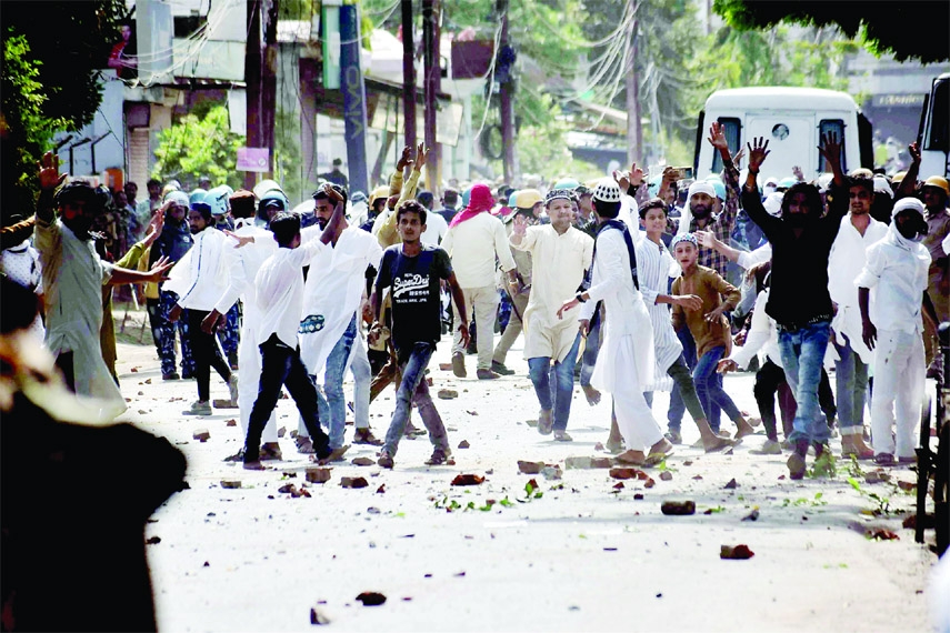 Miscreants throw stones on police during a protest over controversial remarks made by two now-suspended BJP leaders about Prophet Mohammad, in Prayagraj on Saturday.